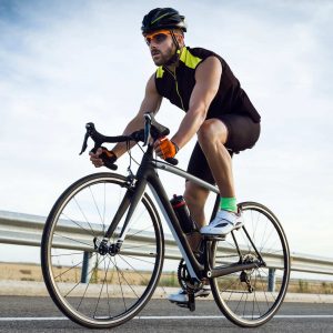handsome-young-man-cycling-on-the-road-2022-12-15-18-18-17-utc-1
